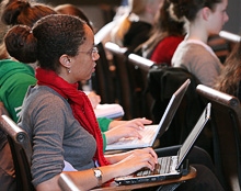 Student taking notes in class
