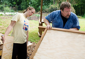 Bob Jones supervises the construction of a farm stand