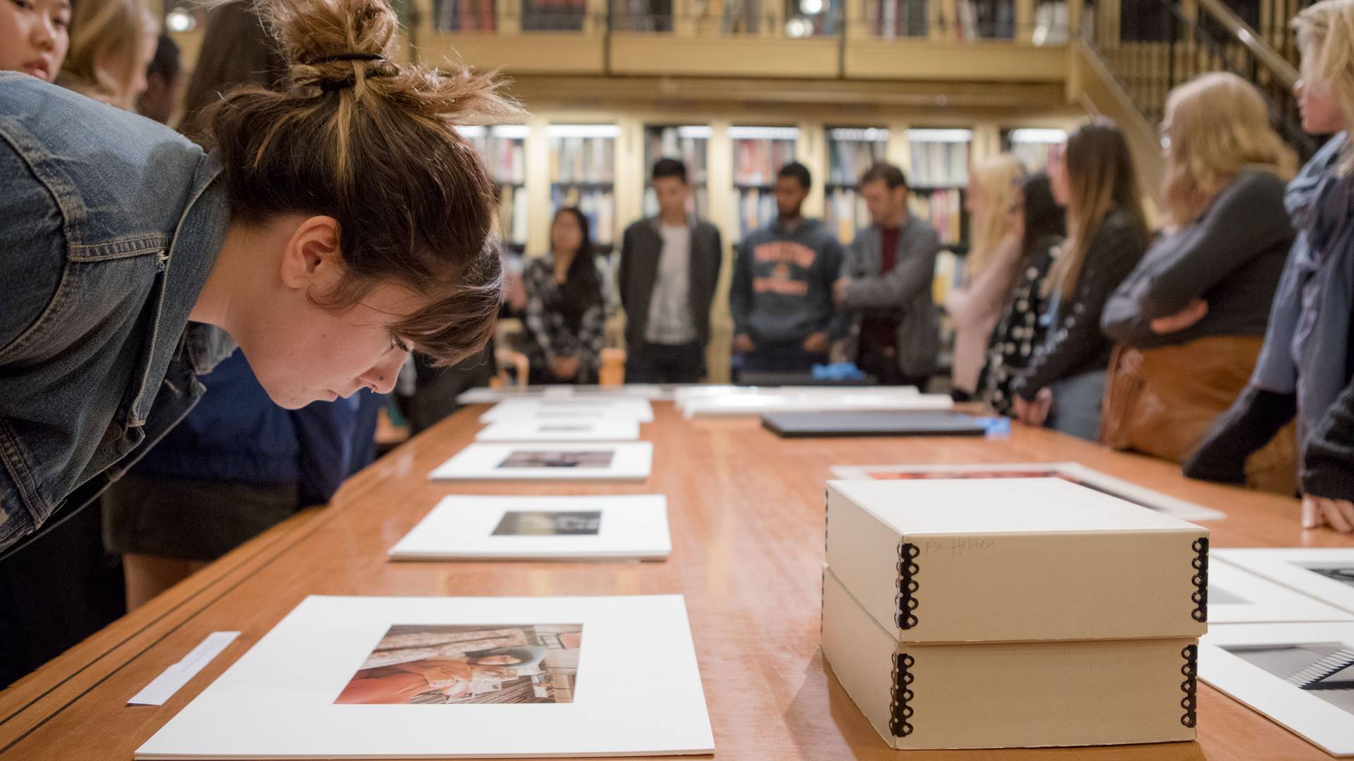 Students looking at photos in New York gallery