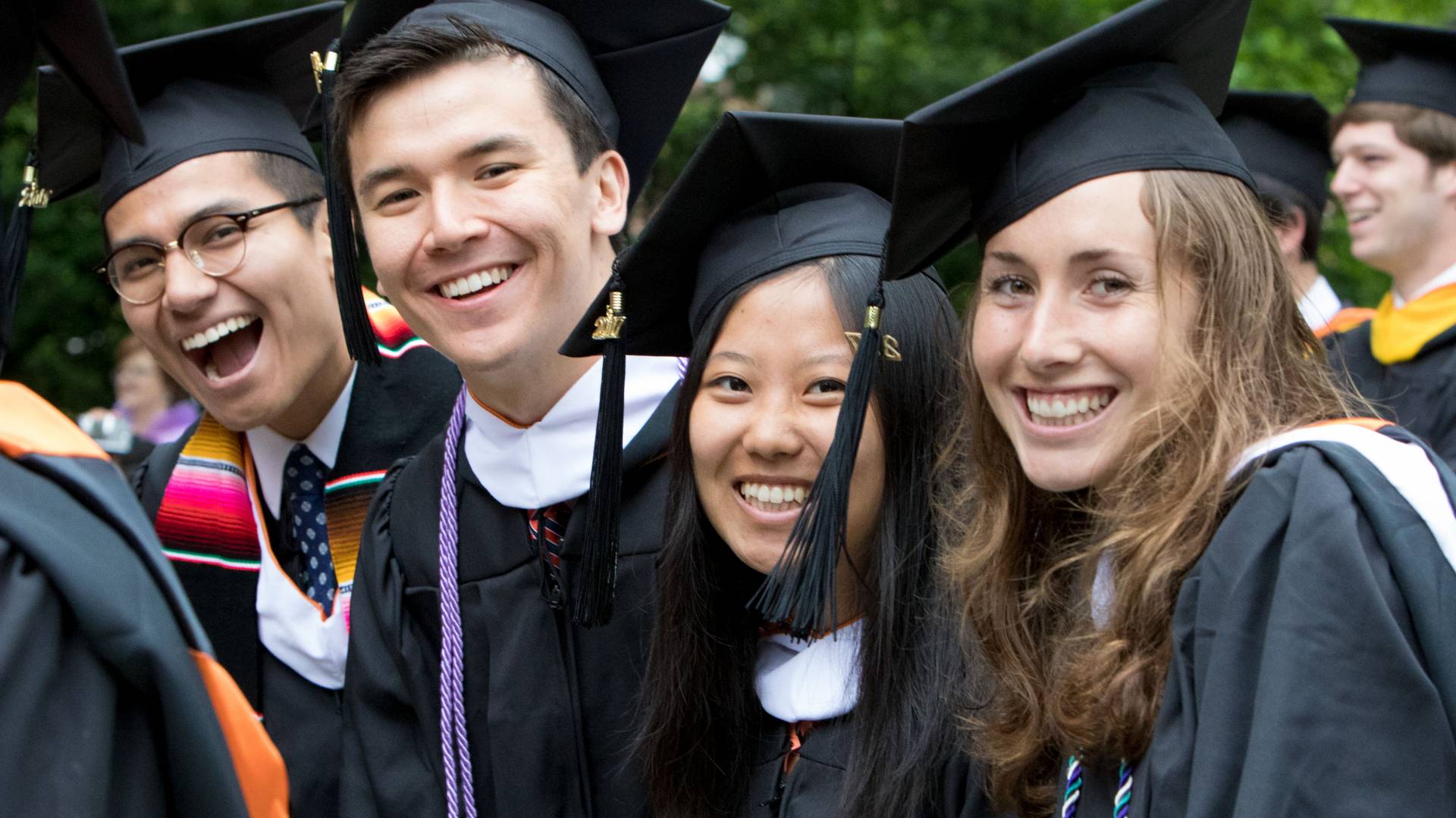 Students smiling at Commencement