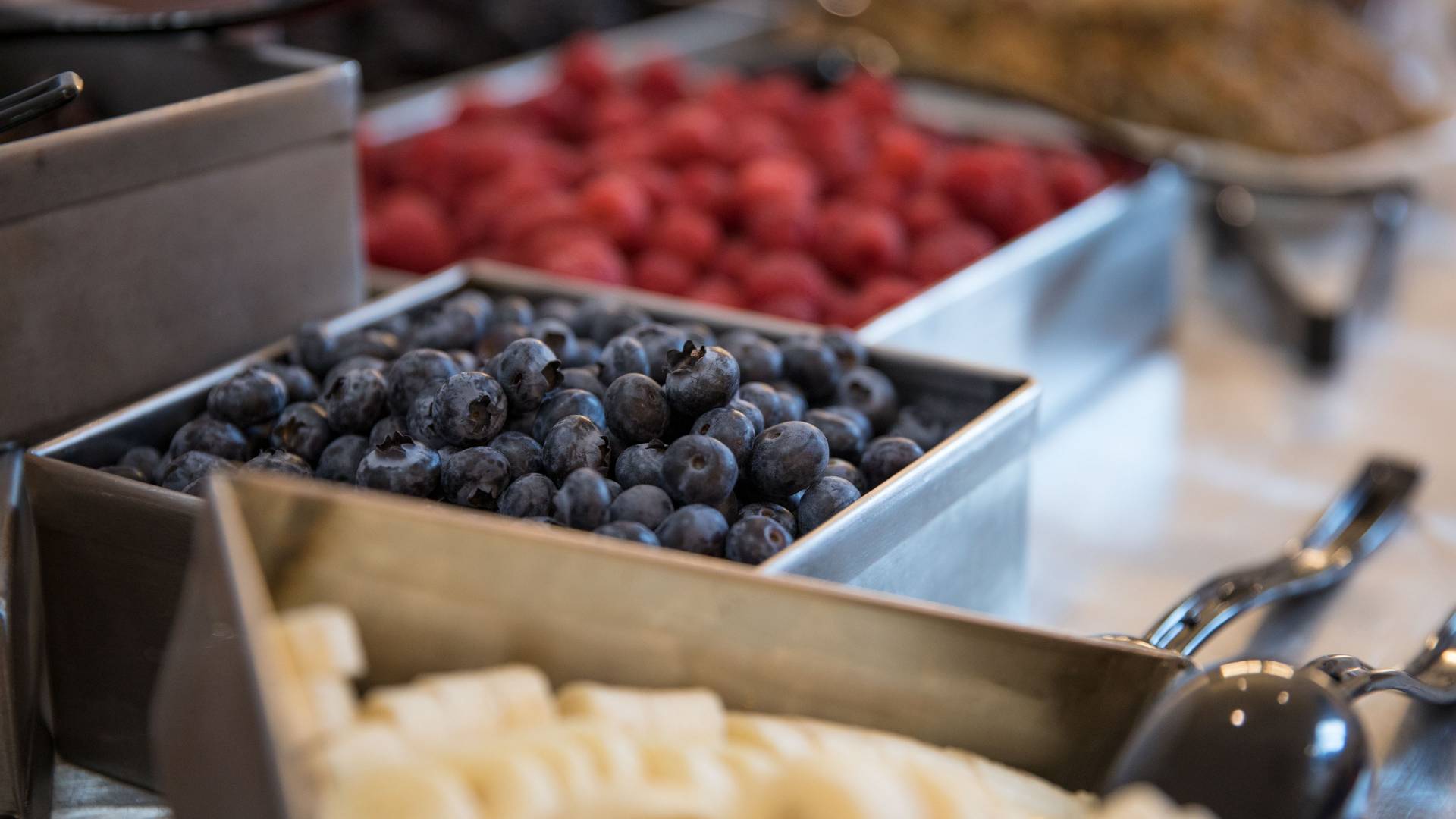 containers of blueberries and raspberries
