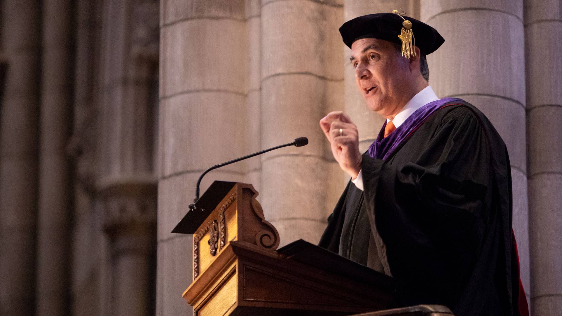 Eduardo Bhatia at podium during Baccalaureate ceremony