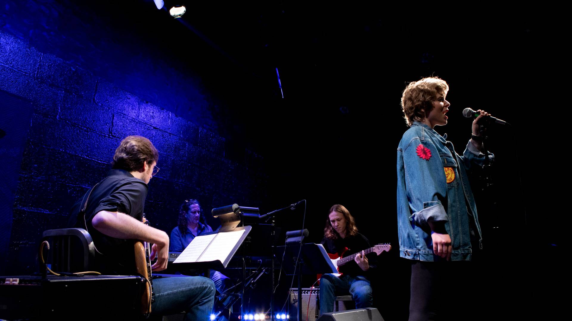 Actors and musicians on stage for musical "Tick, Tick...Boom"