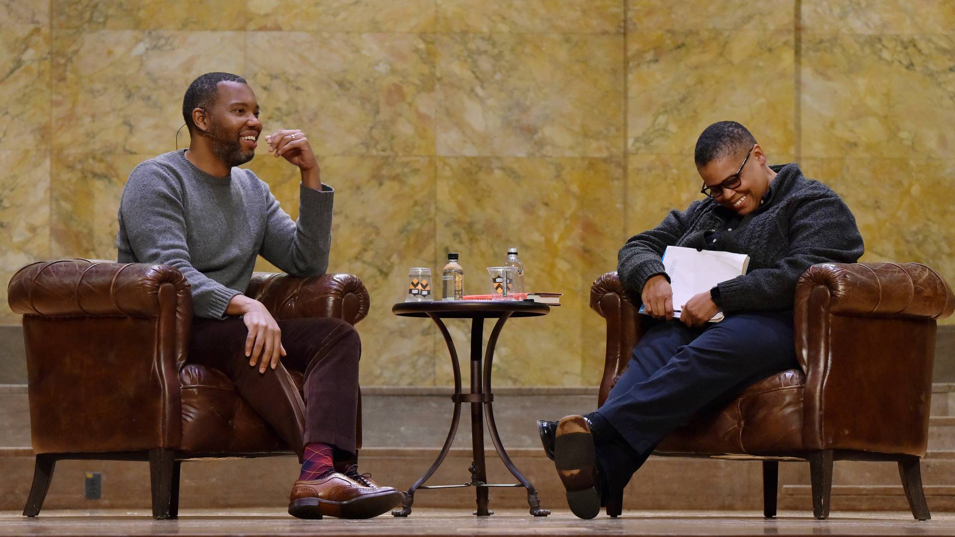 Ta-Nehisi Coates (left) and Keeanga-Yamahtta Taylor share a joke onstage during Coates' lecture