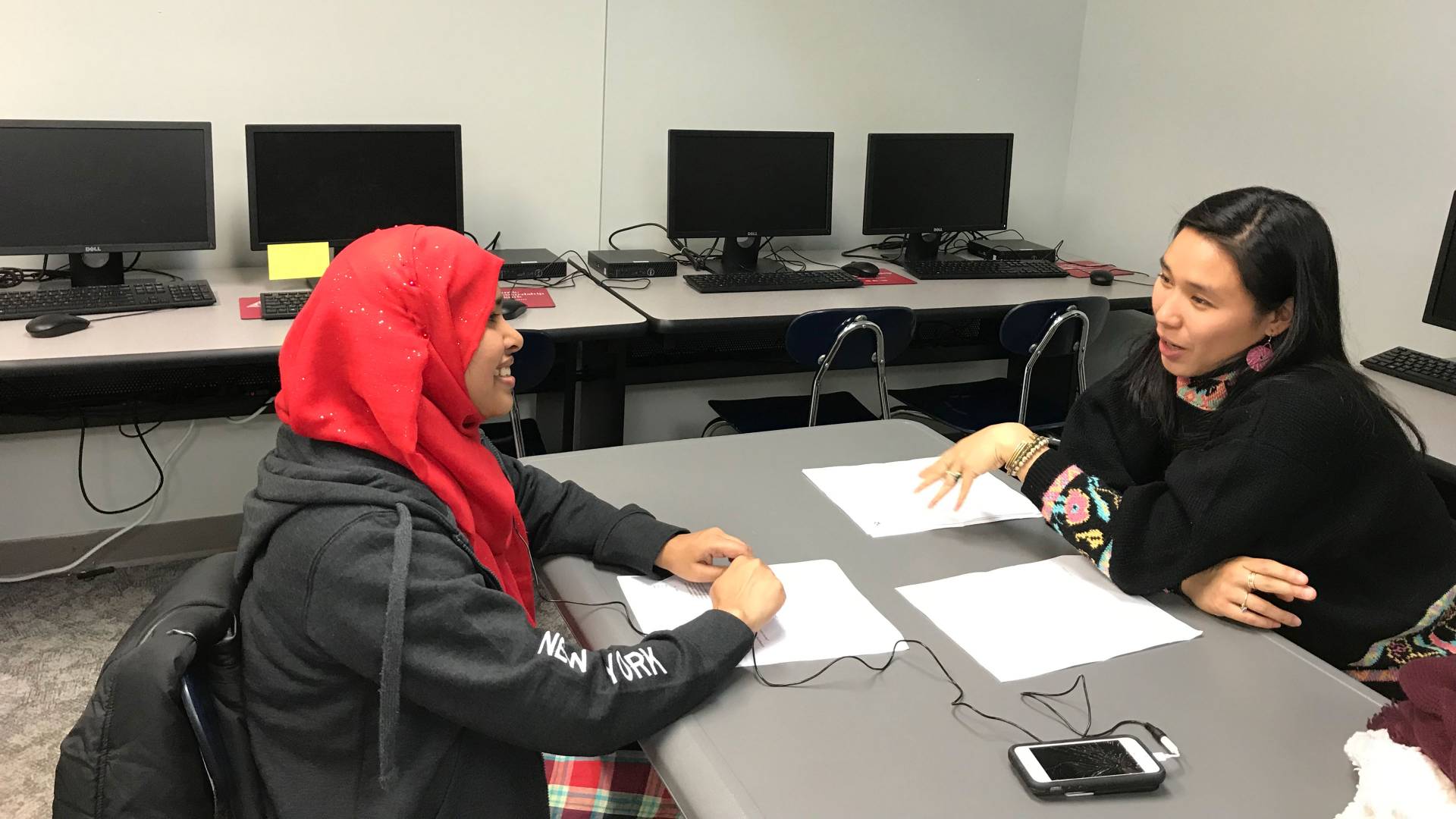 Student speaking with woman
