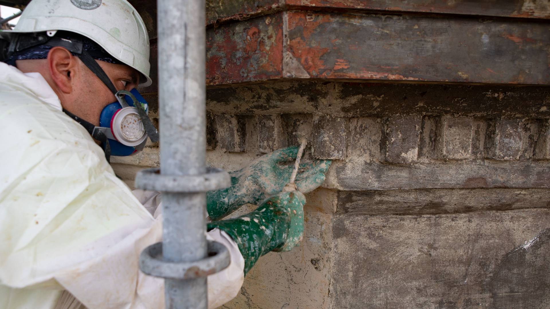 Worker working on stone on Nassau Hall cupola