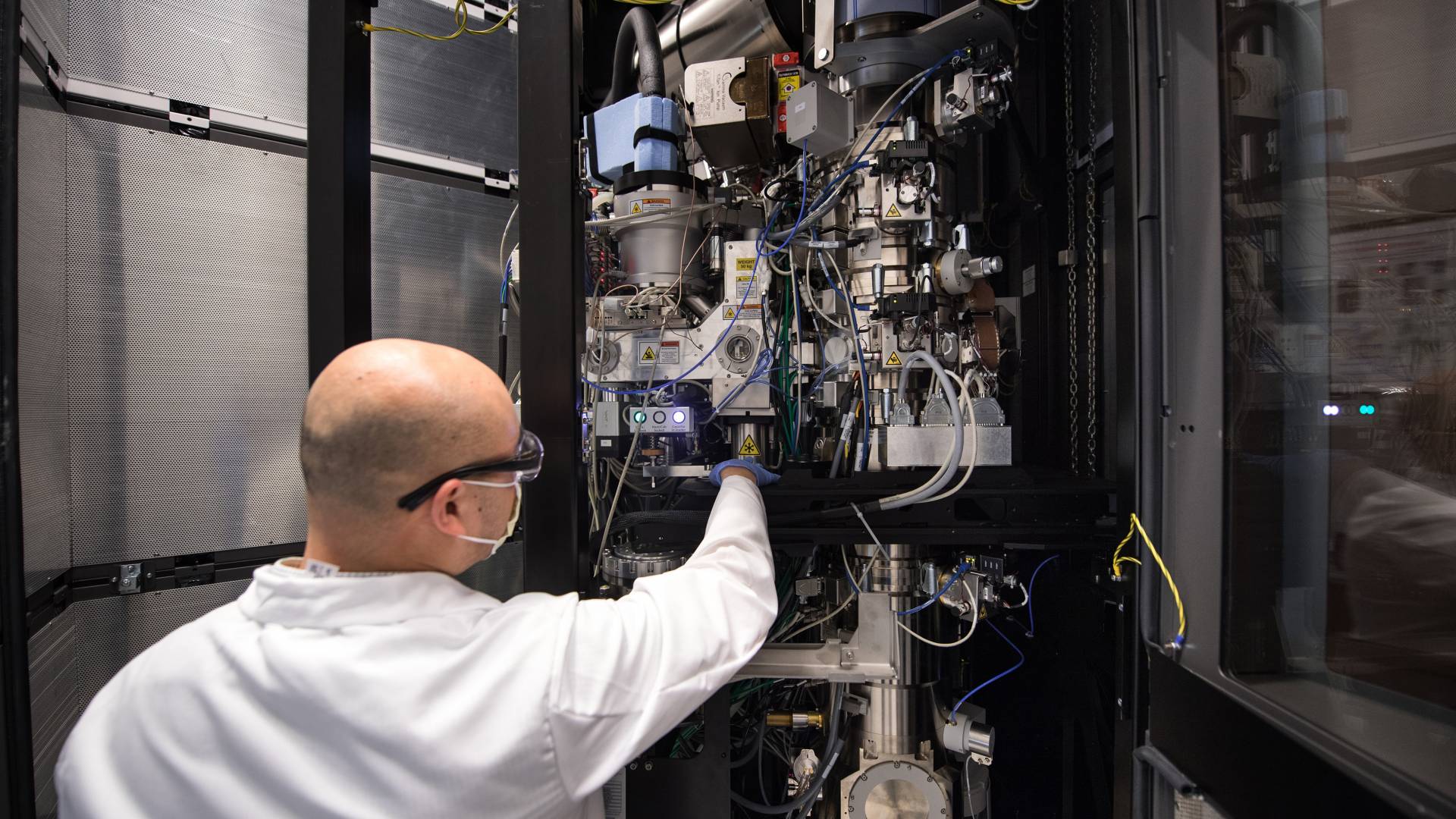 Paul Shao, imaging and analysis specialist, adjusts Princeton's cryo-electron microscope