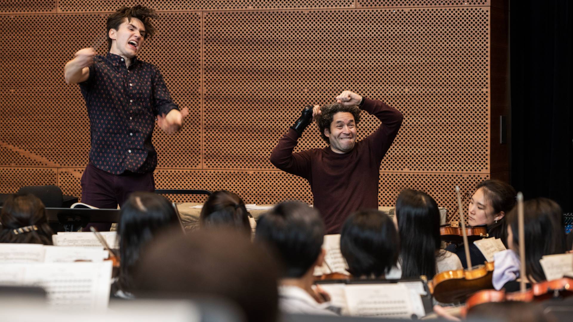 Reilly Bova and Gustavo Dudamel conducting orchestra