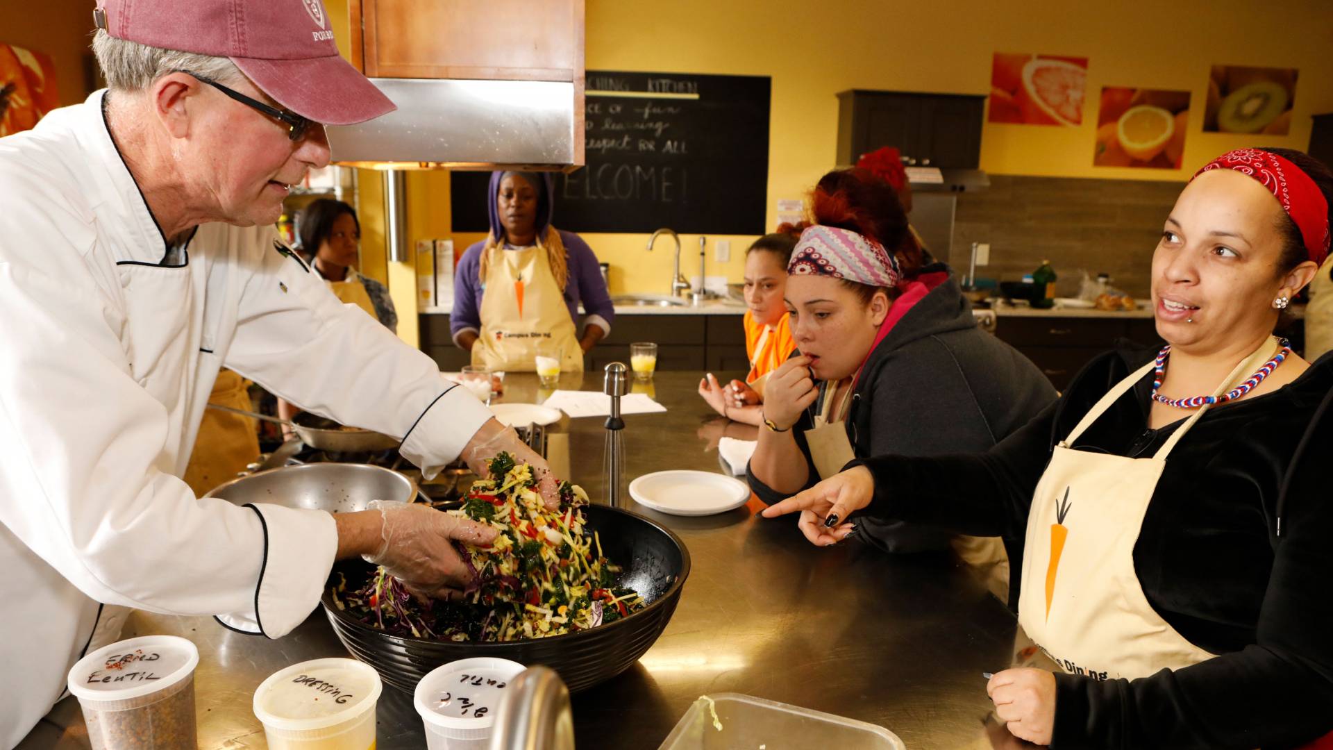 Alexander Trimble showing HomeFront clients how to make meals