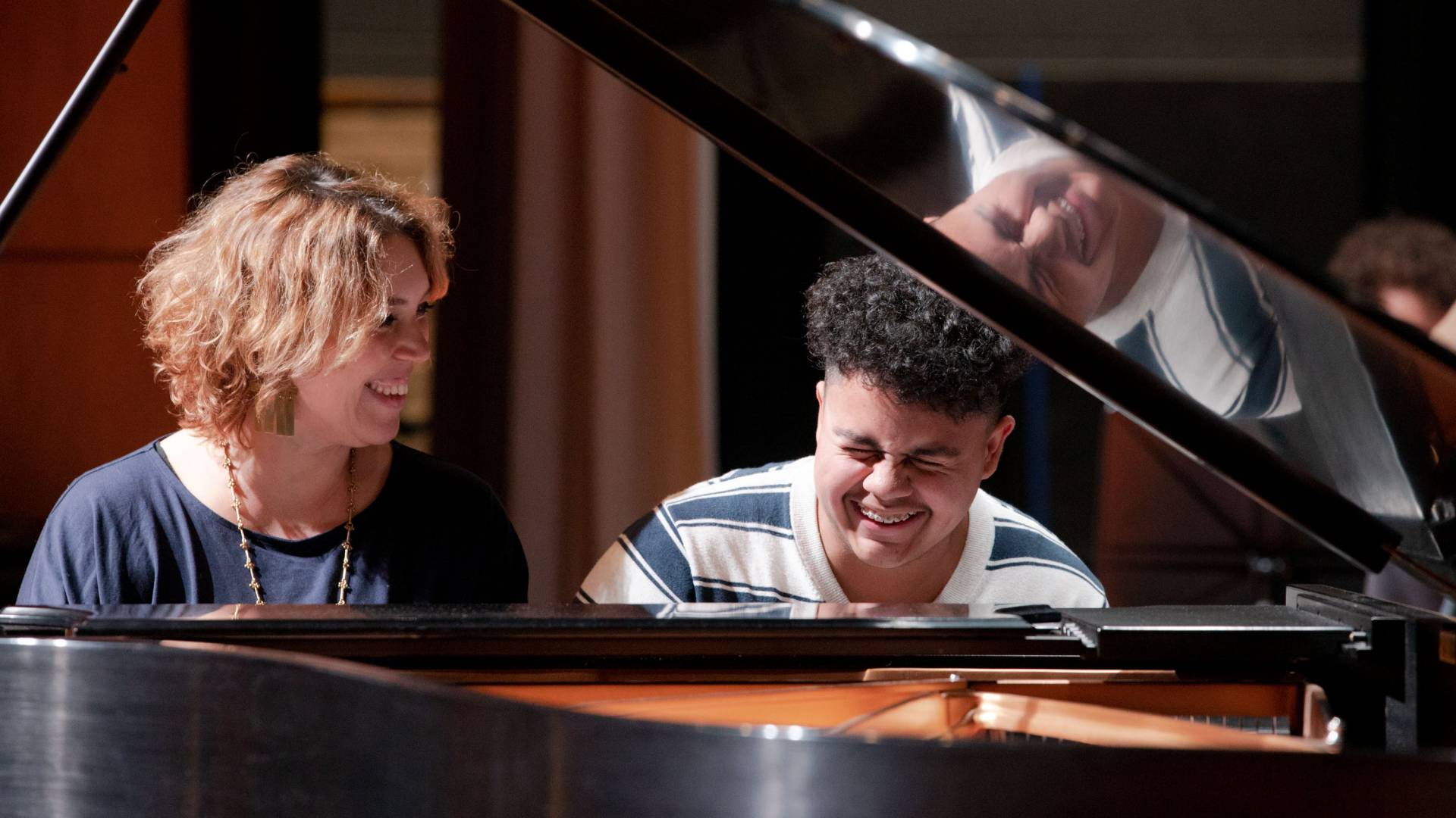 Montero shares a laugh with student