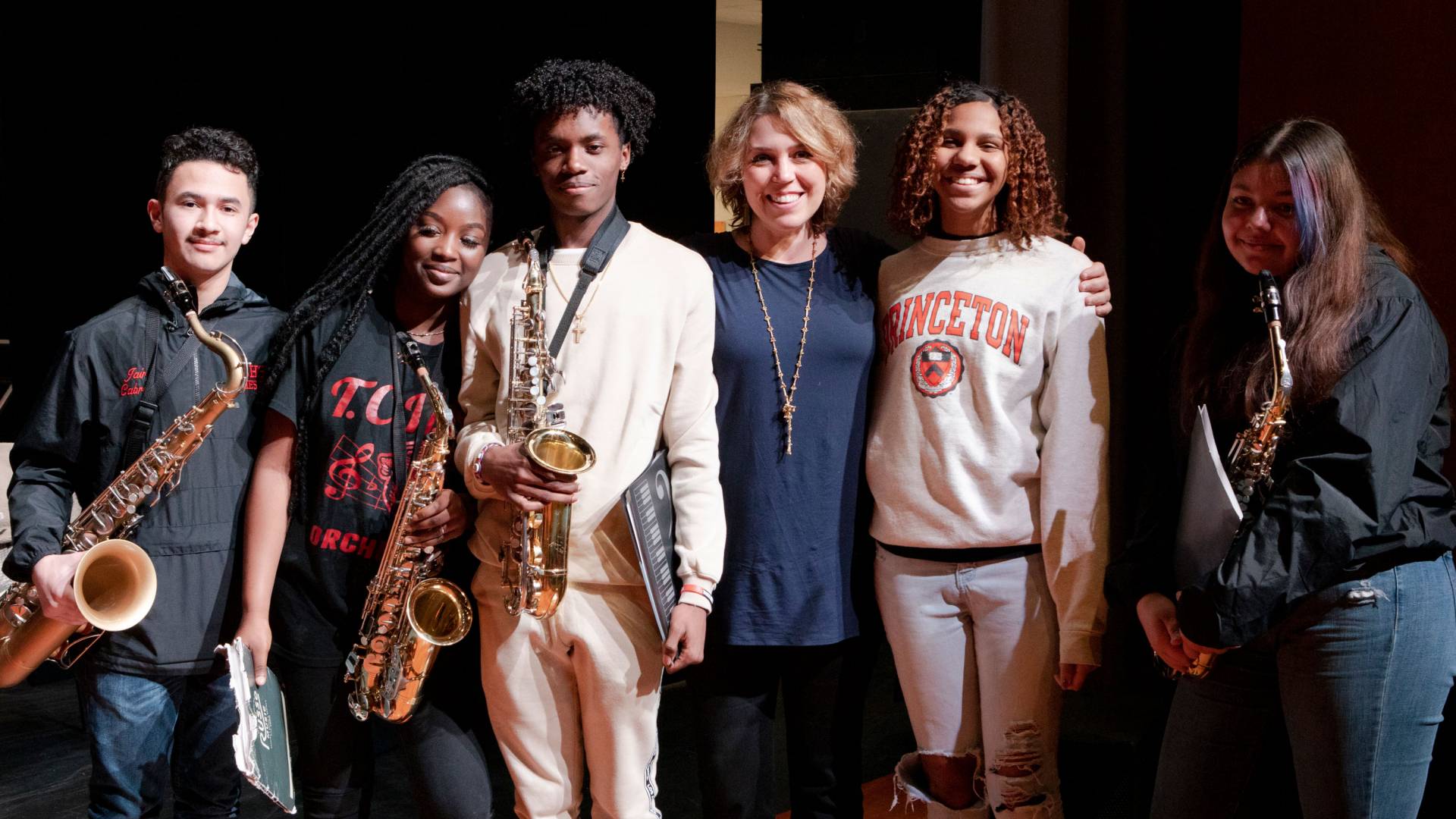 Montero poses with some students