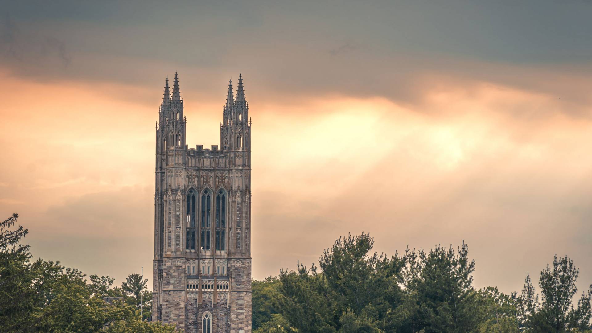 Graduate college in twilight and shafts of light