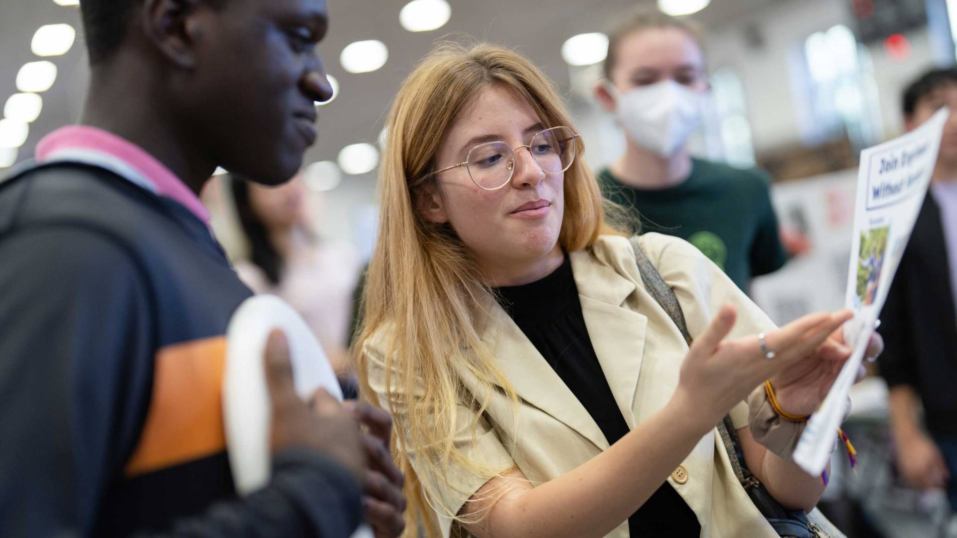 A student points to a flyer