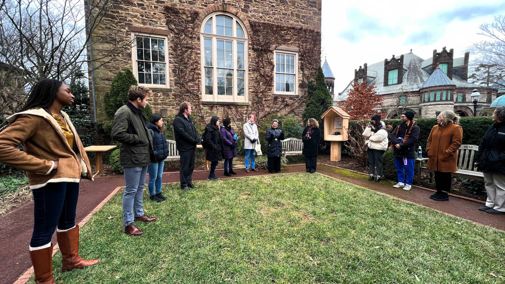 Students gather to look at a wind phone