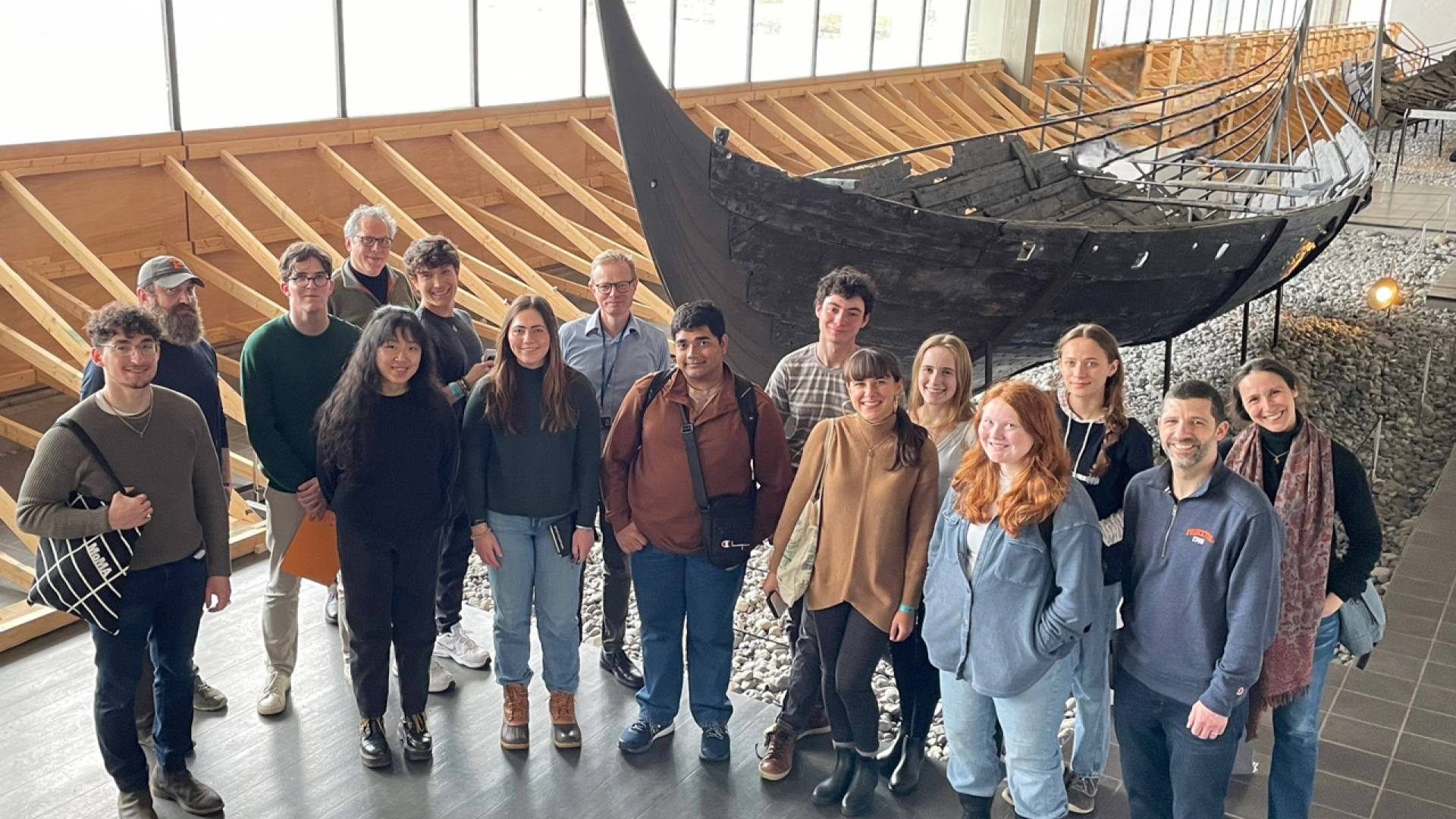 Students in front of an old boat