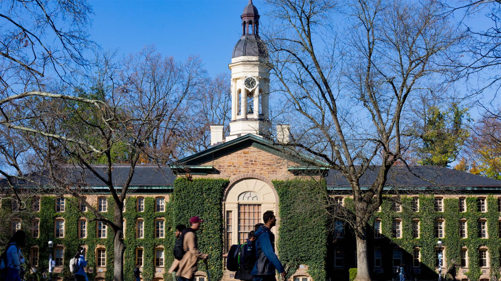 Students walking past a campus building