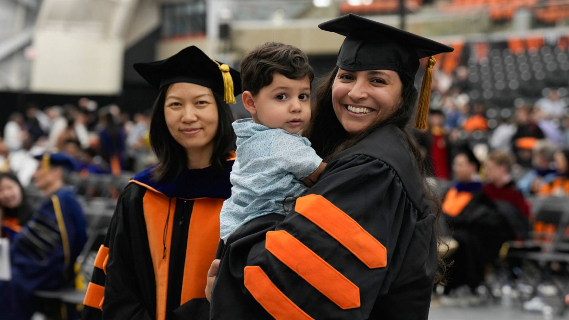 Avantika Gori (right) and her child await hooding by Ning Lin (left), a professor of civil and environmental engineering. Gori completed her degree in November 2023 and started as an assistant professor in civil and environmental engineering at Rice University in January 2024.