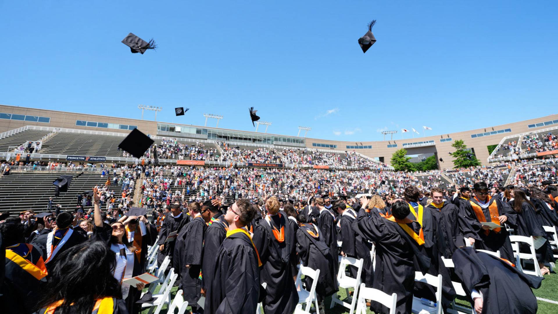 Students throwing their graduation hats up in the air.