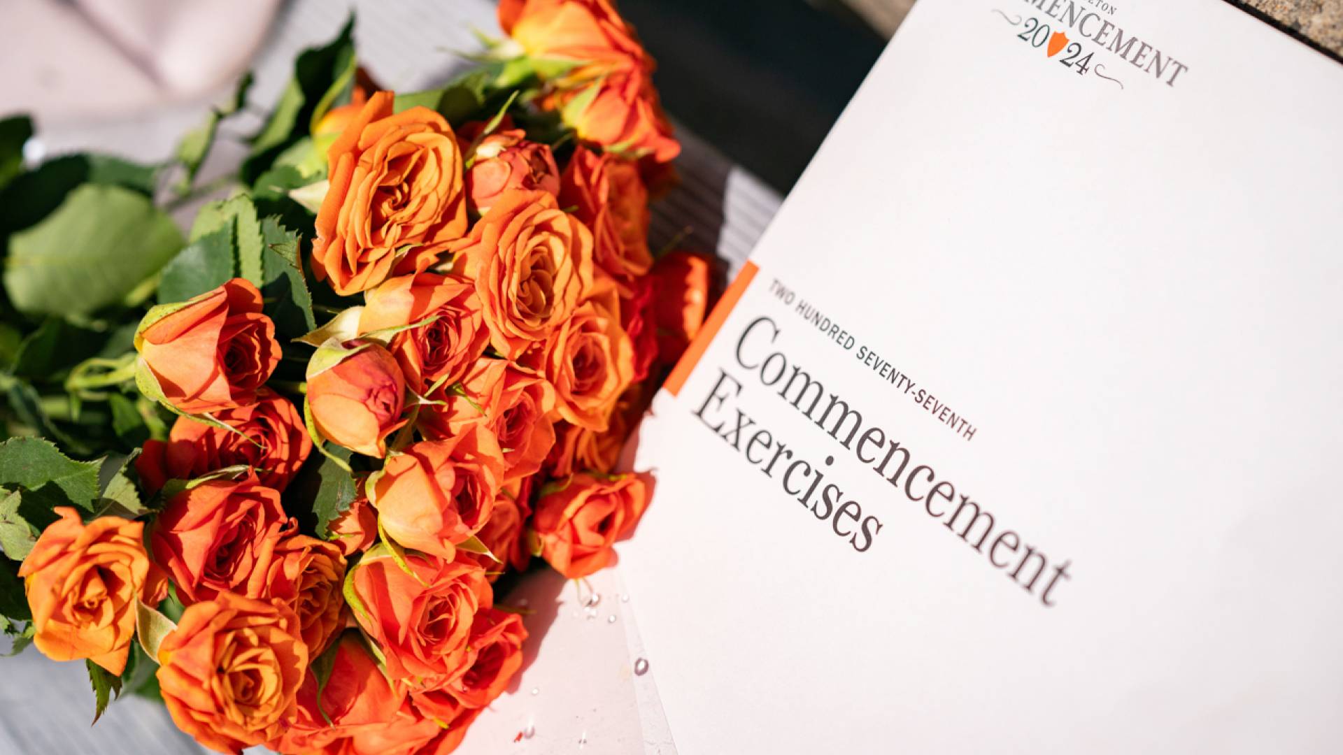 Commencement Program next to flowers