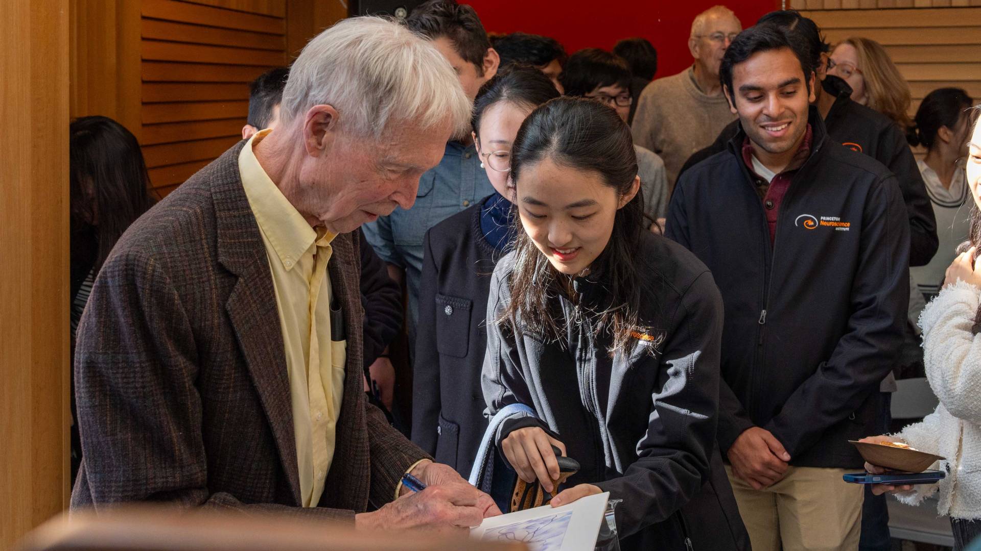 A student asks Hopfield for an autograph