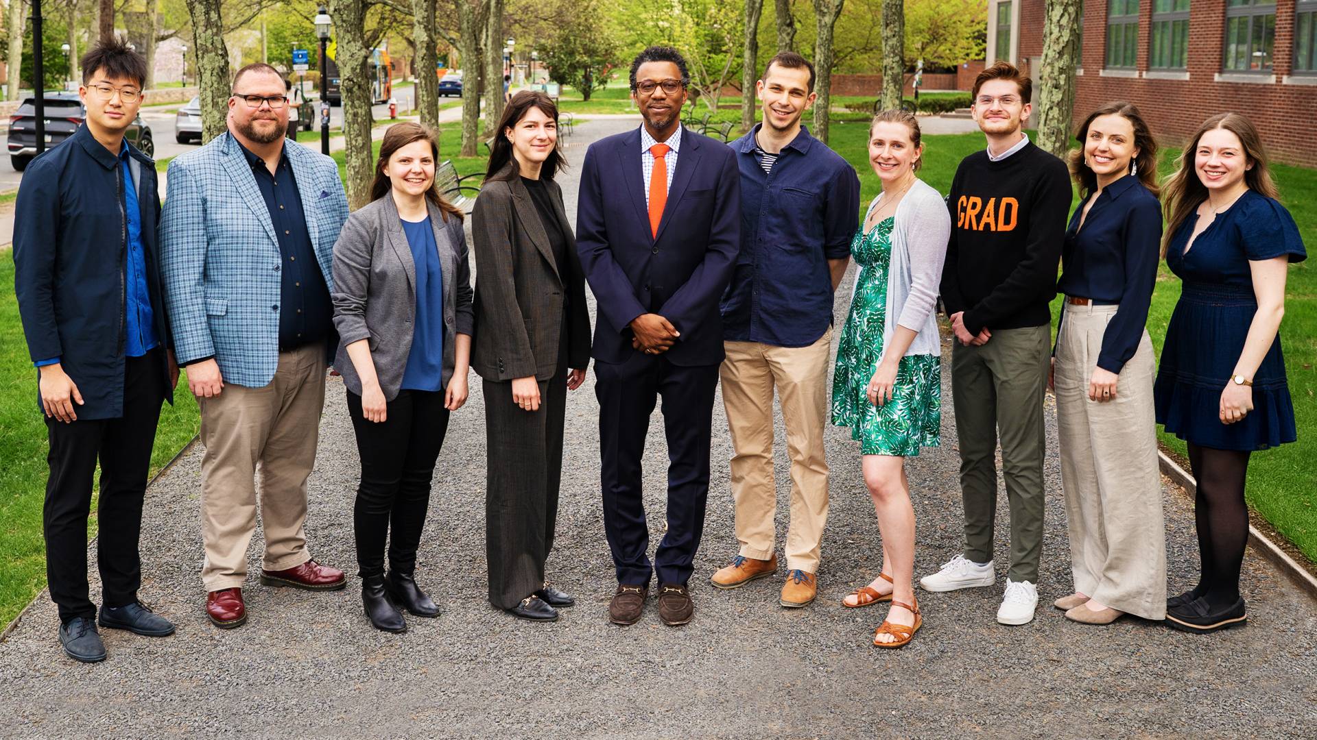 Graduate students honored for their distinguished teaching pose with Dean of the Graduate School Rodney D. Priestley