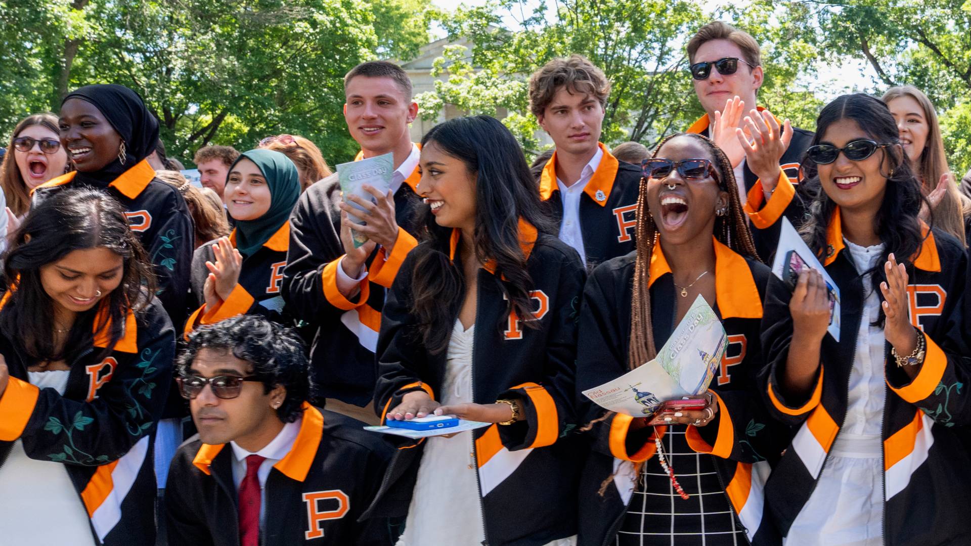Students applaud award winners.