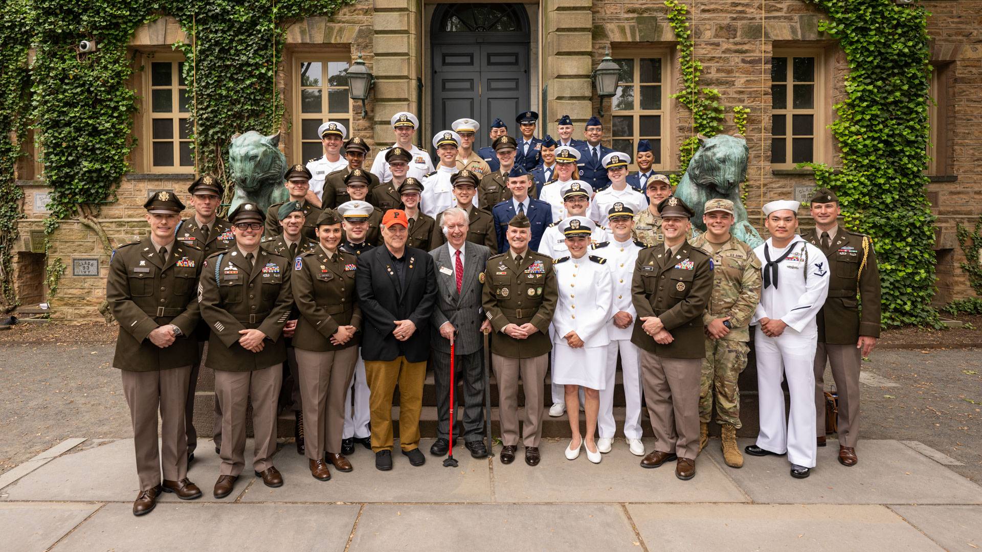 A group shot with people from all branches of military standing outside Nassau Hall.