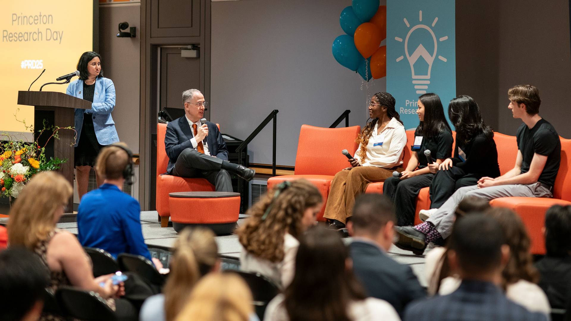 Dean for Research Peter Schiffer interviews award winners on stage at Princeton Research Day.