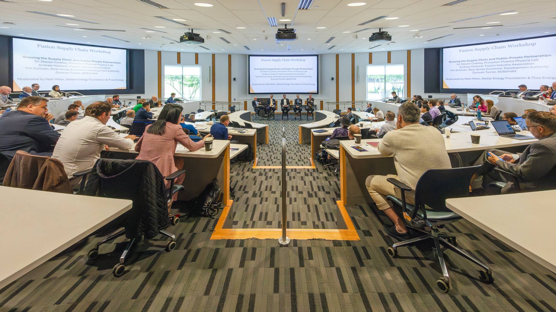 Experts attend a presentation in a packed Rutgers classroom during the fusion supply chain conference.. 
