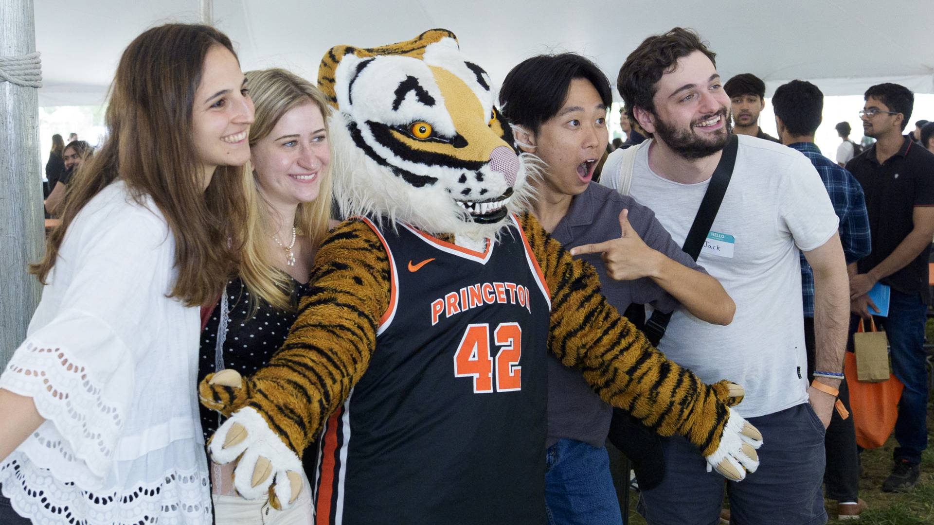 Additional graduate students with the school mascot.