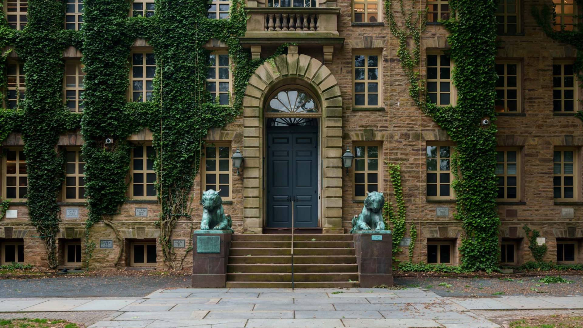 Entrance door to Nassau Hall, flanked by two tiger statues.