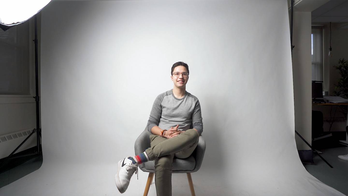 David Lopera sits in a chair