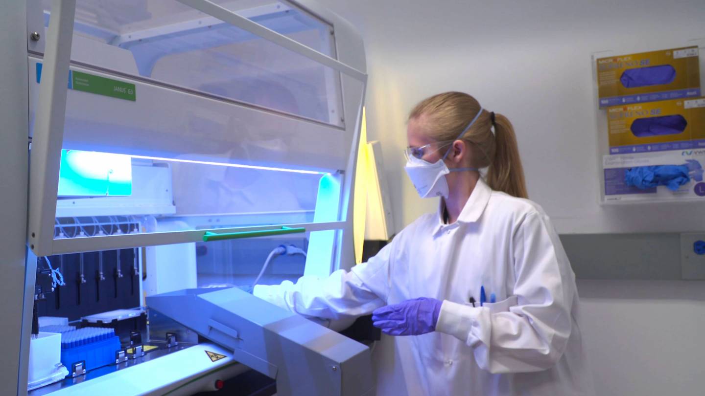 Lab technician handles samples