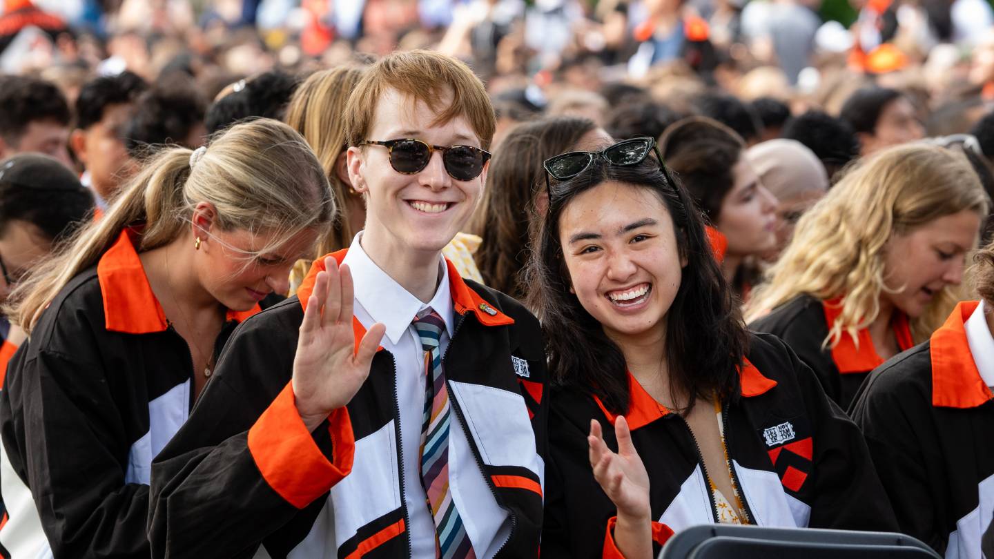 Smiling seniors wearing their class jackets