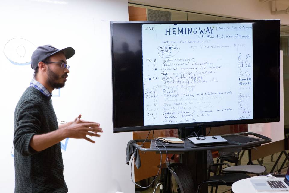 student speaking in front of screen at Center for Digital Humanities