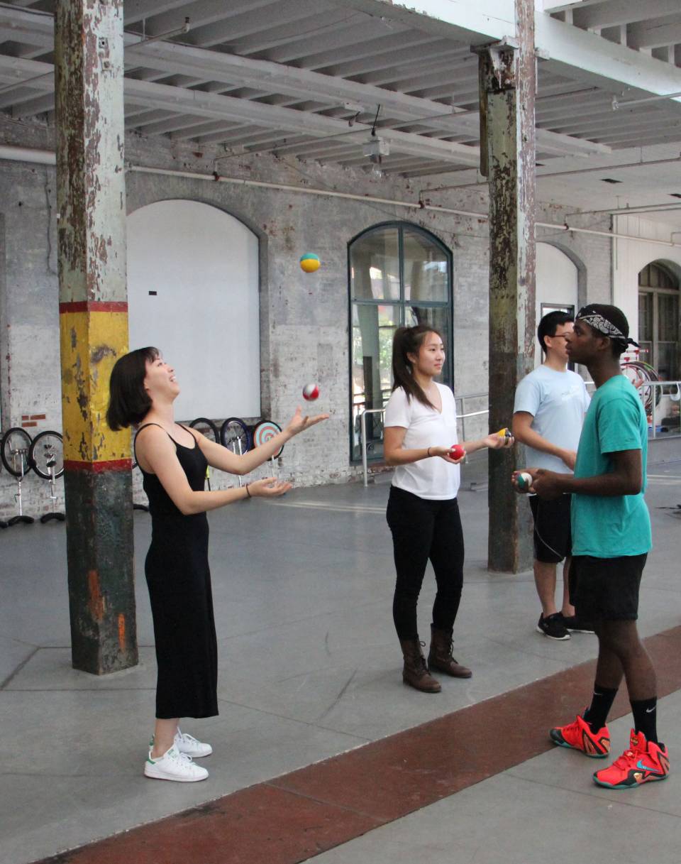 Students learning how to juggle