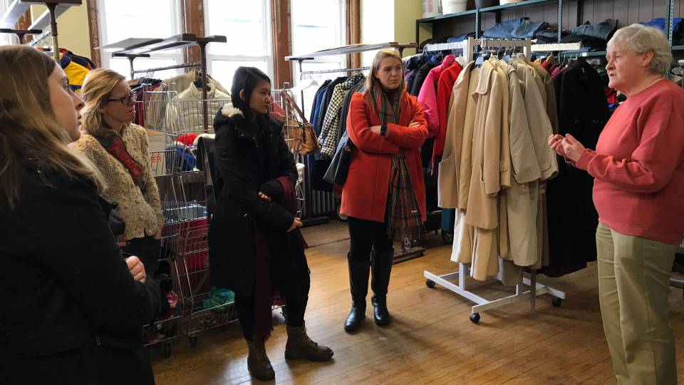 Students meeting with Sister Mary at clothing bank