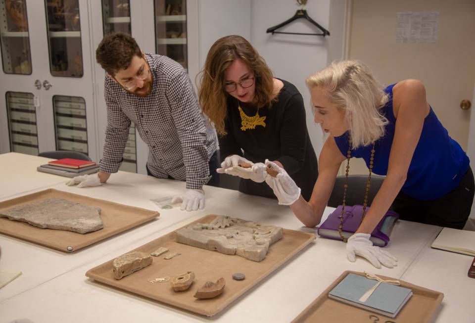 Students looking at ancient artifacts at Art Museum
