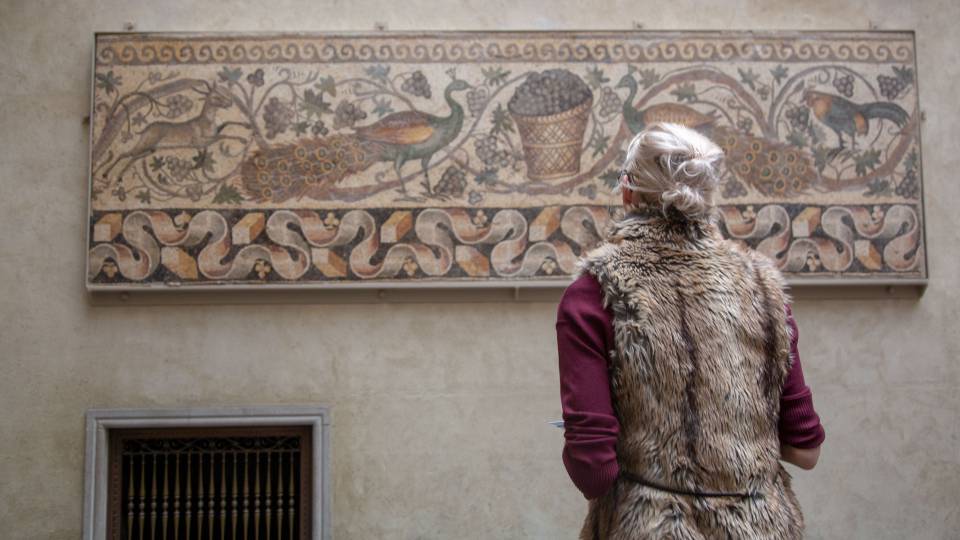 Student looking at mosaic at Worcester Museum of Art