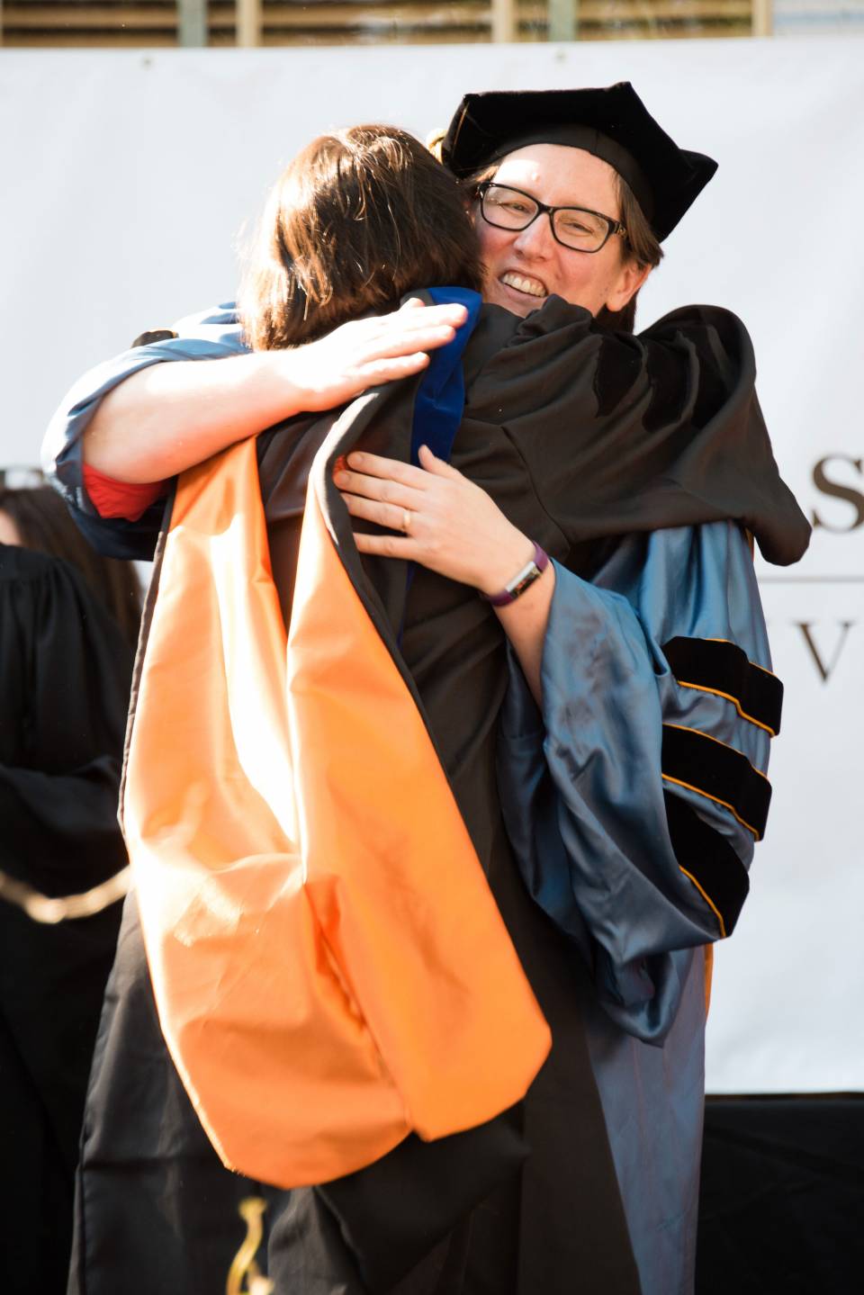 Jennifer Rexford hugging Mina Tahmasbi Arashloo