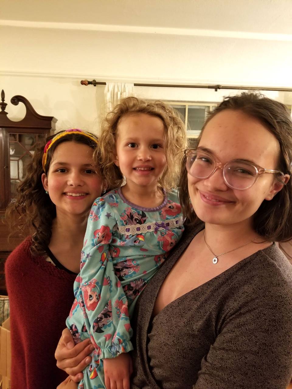 A student poses with her family