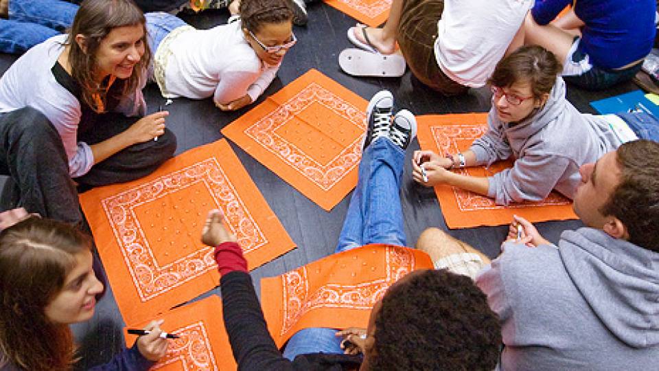 circle of students with handkerchiefs