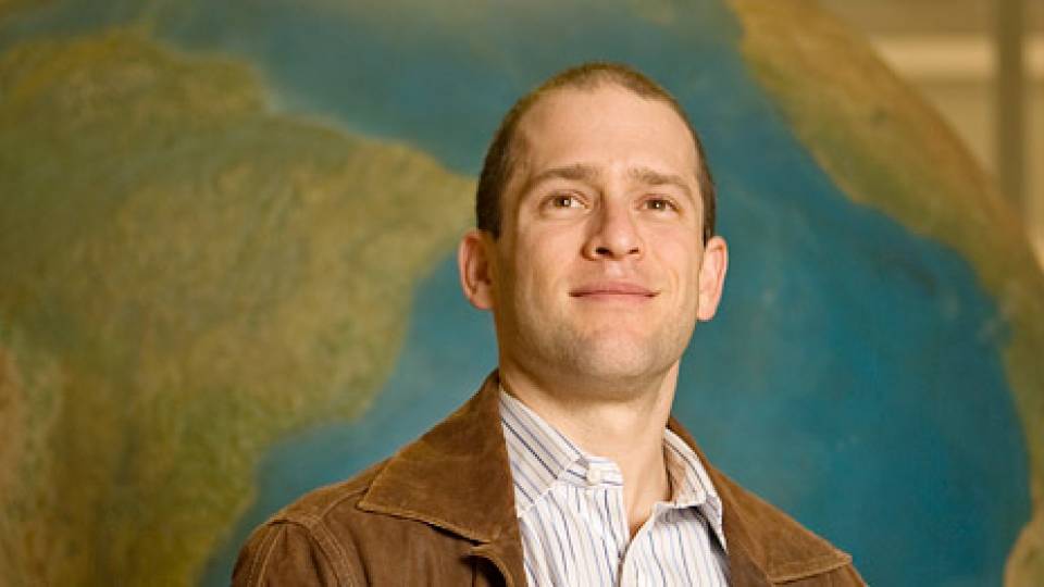 Shapiro in front of globe