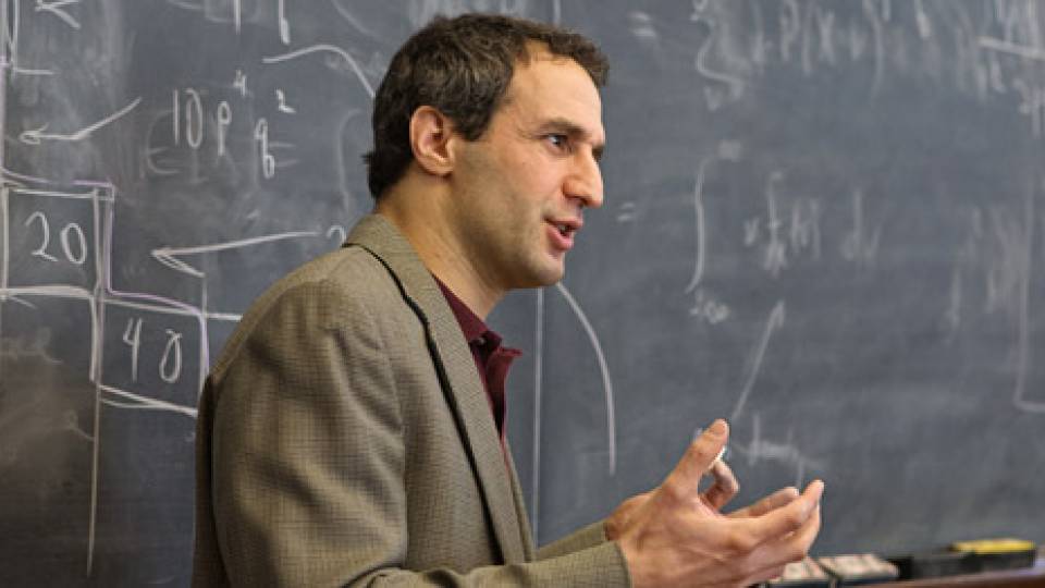 Elga in front of chalkboard