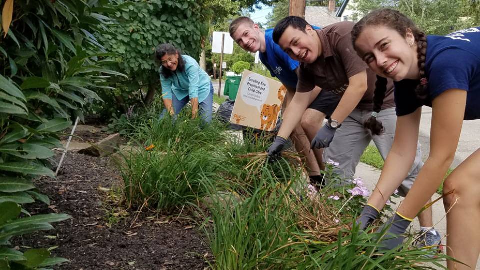 Orientation 2016 Sylvie Thode, a first-year student from New York City, Andres Irribarra, a first-year student from Chile, Justin Hamilton, a first-year student from Limestone, Maine, and Maria LoBiondo, Editorial Coordinator with Development Communications in the Office of Development, help clean up the gardens outside Princeton Nursery School 