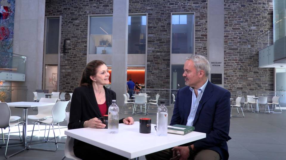 Sandra Bermann and Stephen Macedo chatting at table