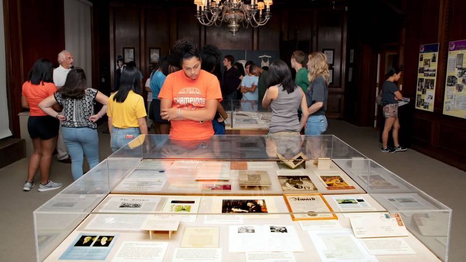 Students looking at an exhibit on Louis Bamberger at NJ Historical Society