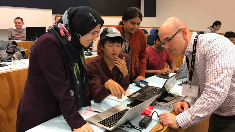 People gathering at a computer