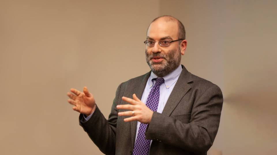 Michael Gordin gesticulates while lecturing