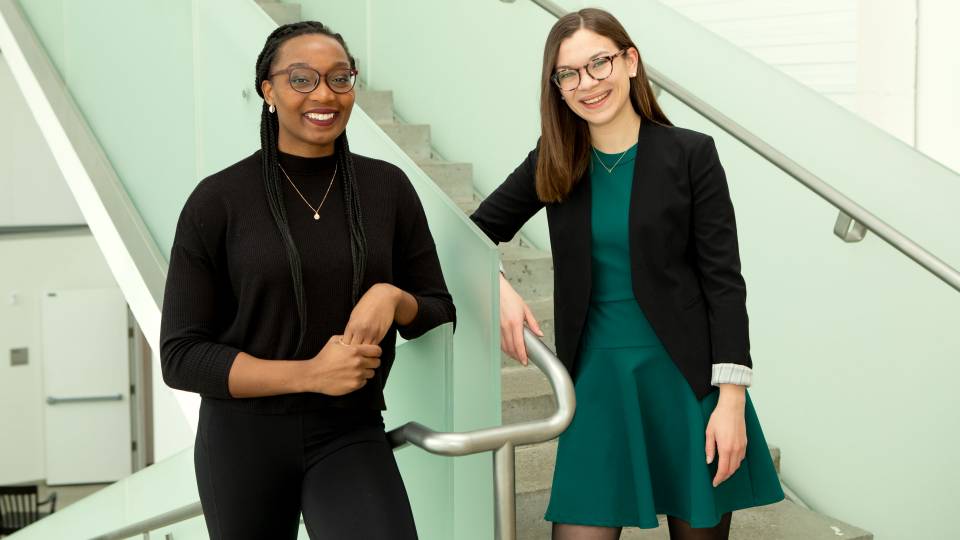 Sydney Jordan and Annabel Barry standing in stairwell